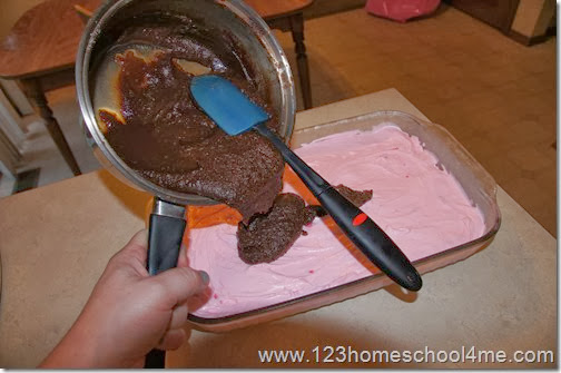 Spoon on the decadent fudgy ice cream topping Spoon on the decadent fudgy ice cream topping