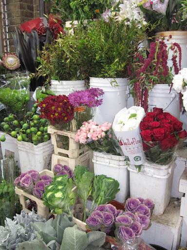 A selection of flowers can be found inside of the store.