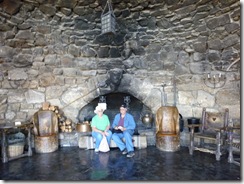 Fred and Wilma sitting in front of the fireplace