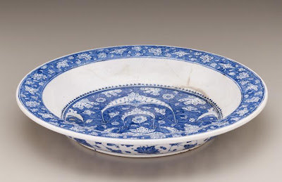 Plate | Origin:  Iznik,  Turkey | Period: ca. 1500  Ottoman period | Details:  This elegant dish combines blossoms, leaves, and crescent-shaped motifs linked by gracefully interlaced and knotted tendrils. It belongs to a group of blue-and-white wares produced in the Turkish city of Iznik during the early sixteenth century. Inspired by manuscript illumination, reverse-painted motifssome outlined and shaded in dark blue to create a three-dimensional effectare characteristic of early Iznik ceramics. While the blue-and-white palette and the blossoms circling the interior rim and exterior well recall Chinese porcelains, these elements are now synthesized into a new and original style expressing Ottoman sensitivity and taste. | Type: Composite body painted under glaze | Size: H: 6.5  W: 39.3   D: 39.3  cm | Museum Code: F1954.3 | Photograph and description taken from Freer and the Sackler (Smithsonian) Museums.