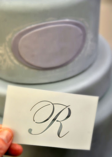 She uses this stencil for the monogram.
