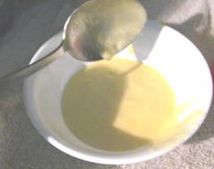 peach jam spoon w foam in bowl