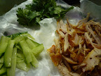 Chicken, cucumbers, and cilantro leaves.