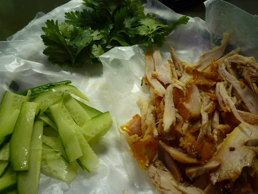 Chicken, cucumbers, and cilantro leaves.