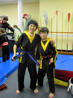 Khai and Kai with their new belts