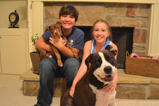This family welcomed little Finn into the fold to join their other rescued pooch who still can't stop kissing him! Finn and the 11 other pups in his litter were rescued with their mama and all were placed into great homes by Animal Action Rescue in Atlanta, Ga. Photo by: Beth LaBauve This family welcomed little Finn into the fold to join their other rescued pooch who still can't stop kissing him! Finn and the 11 other pups in his litter were rescued with their mama and all were placed into great homes by Animal Action Rescue in Atlanta, Ga. Photo by: Beth LaBauve