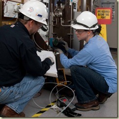 Picture of employees performing maintenance during a 2008 refueling outage at Palo Verde nuclear station.