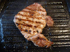 Pork cutlet in the grill pan.