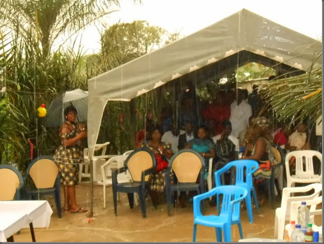 Under the tent in the rain at Sidoni's wedding