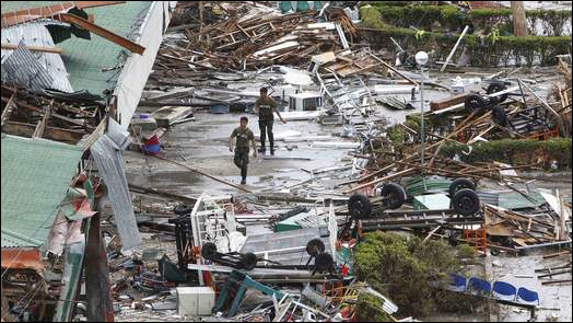 In the wake of Super Typhoon Haiyan, soldiers walk outside of Tacloban's shattered airport terminal, 9 November 2013. Photo: Sky News