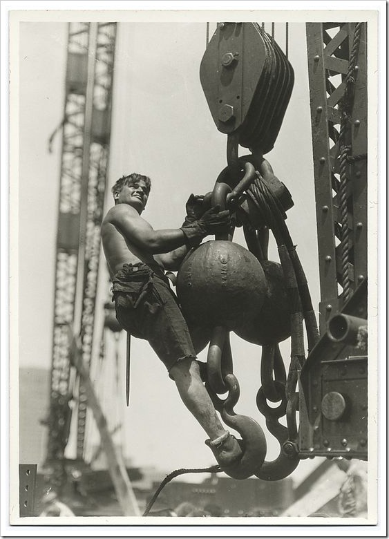A-worker-riding-on-a-crane-hook-1931 A-worker-riding-on-a-crane-hook-1931