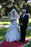 Kelly and her Dad walking down the ailse
