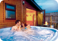 Take a Dip in the Private Hot Tub with the Holiday Lodge