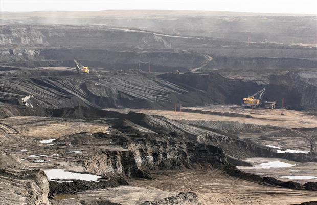 The Suncor oilsands mine near Fort McMurray, Alberta, seen in a 24 September 2010, file photo. This area was boreal forest, before the mine destroyed it. Bruce Edwards, Edmonton Journal