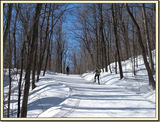 Skiers ascending Penguin Hill to the point where it is joined by Trail 30