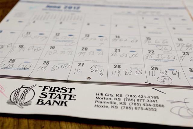 A calendar shows temperatures recorded by Bob Richmeier, in Hill City, Kan., June 30. Hill City, best known for its bountiful pheasant hunting and museum of oil history, suffered through five days of brutal heat that topped out at 115 degrees. Steve Hebert / The New York Times via Redux Pictures