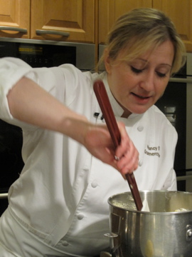 Nancy hard at work stirring up dry ingredients for her lemon cake. Nancy hard at work stirring up dry ingredients for her lemon cake.