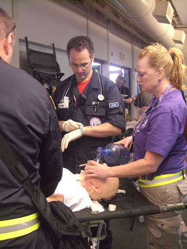 Medical staff perform routine tests on a mock patient. (Photo credit: Jennifer Moore)