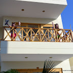 Emma and Lily are psyched to have a balcony and be in the warm beachside sun.of Paracas