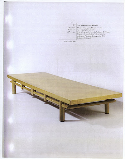 A coffee table by T.H. Robsjohn-Gibbings. A coffee table by T.H. Robsjohn-Gibbings.