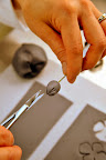 Then, she uses a small scissor to snip the center.