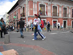 Walking around town we spotted a couple of these vendors selling dog coats and dog hats. Yes, dog hats. You can see her (probably) reluctant model just past her legs.