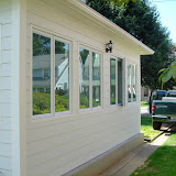 The sunroom with siding and windows installed