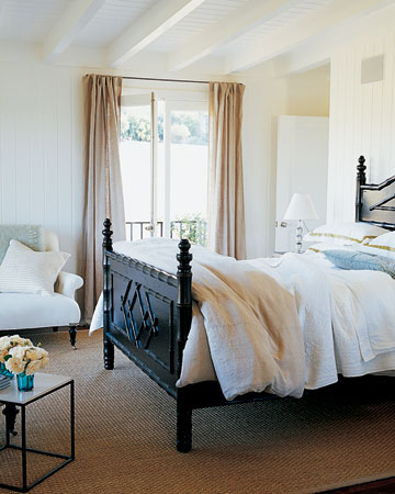 The white painted paneling gives this room a cheerful glow.