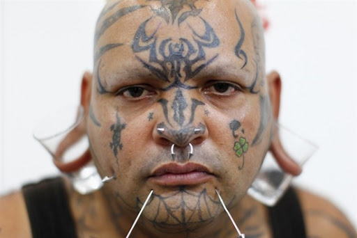 Constantino Quintero from Venezuela poses during a tattoo exhibition in 