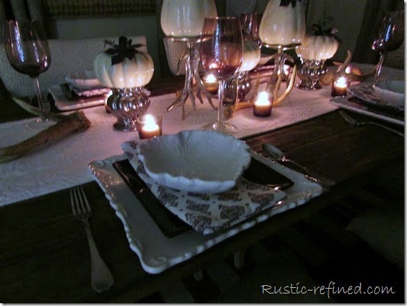 A Fall Night Tablescape using antlers, white dishes and gorgeous ceramic pumpkins