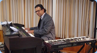 Ben Fernandez playing the Clavinova. At some stages of the Concert, Ben was playing both the Clavinova and Hammond concurrently! Photo courtesy of Dennis Lyons.