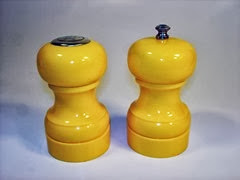 Yellow plastic set of salt shaker and pepper mill by Peter Piper