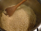 Pour in some white wine and stir.
