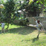 Miguel Angel kicking the ball away from the goal as Luis watches.
