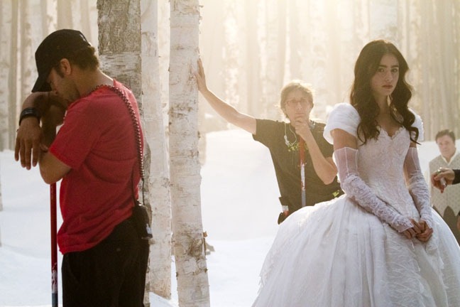Snow dressers Stacy Godding and Claire Belisle wait on set with Lily Collins, "Snow White," September 13, 2011