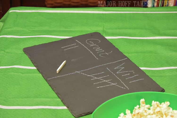 Use slate as chalkboard. Looking for a fun party for your teenage boy? Why not throw a Football video game party? Easy ideas for how to entertain kiddos during the Big Game. Features DiGiorno pizza, personalized football cups, free printable lanyards, and an incredible recipe for football shaped ice cream sandwiches! #GameTimeMVP #CollectiveBias #ad Use slate as chalkboard. Looking for a fun party for your teenage boy? Why not throw a Football video game party? Easy ideas for how to entertain kiddos during the Big Game. Features DiGiorno pizza, personalized football cups, free printable lanyards, and an incredible recipe for football shaped ice cream sandwiches! #GameTimeMVP #CollectiveBias #ad