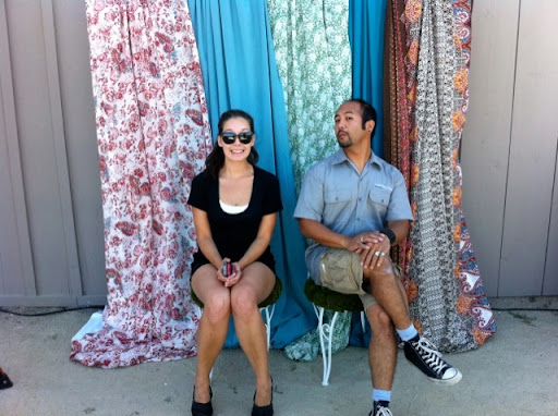 Alyssa and Marcel, from the lighting company, make sure the photo booth is ready for guests.