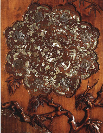 The rosette on this armoire is inlaid with mother-of-pearl. ( The rosette on this armoire is inlaid with mother-of-pearl. (