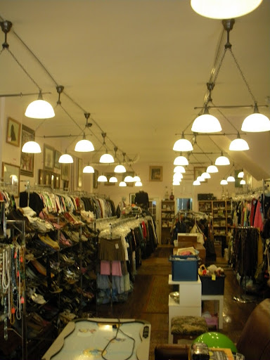 Unique Boutique has these great lighting fixtures inside. They're very industrial, but they don't overwhelm the space.