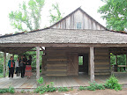 The log cabin in the East Texas area was my absolute favorite. It is a very old, original structure, but I love the huge overhanging roof so that the family could basically live outdoors. I know I could live here happily!