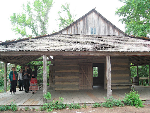 The log cabin in the East Texas area was my absolute favorite. It is a very old, original structure, but I love the huge overhanging roof so that the family could basically live outdoors. I know I could live here happily!