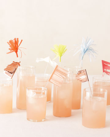 Plexiglas stirrers add punch to signature drinks when they're decked out with petite pennants and pom-poms reminiscent of fireworks. (marthastewartweddings.com) Plexiglas stirrers add punch to signature drinks when they're decked out with petite pennants and pom-poms reminiscent of fireworks. (marthastewartweddings.com)