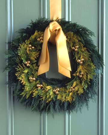 Go for the gold and enrich a simple cedar wreath with tiny bells, sprigs of golden cedar, and a matching satin bow. Go for the gold and enrich a simple cedar wreath with tiny bells, sprigs of golden cedar, and a matching satin bow.