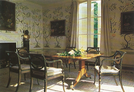 The walls' large-scale serpentine tree design feels like untouched 18th century paintwork.