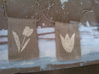 We loved the idea for tulip-bulb favor in a stenciled burlap bag. We tested a couple of stencils before choosing the one on the left.
