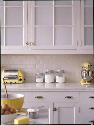 Opaque glass in cabinet doors gives the kitchen a light feeling while still concealing cabinet contents. Opaque glass in cabinet doors gives the kitchen a light feeling while still concealing cabinet contents.