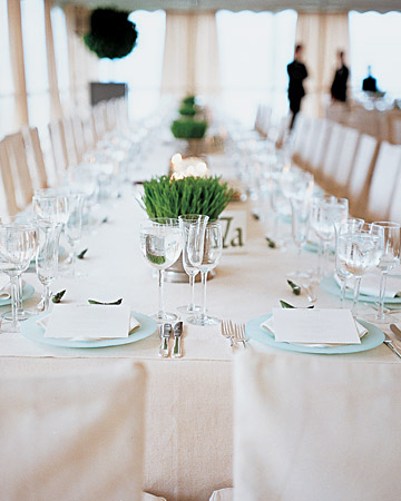 Quiet, aqua chargers are brought to life with simple grass clusters as centerpieces. (http://www.marthastewartweddings.com/) Quiet, aqua chargers are brought to life with simple grass clusters as centerpieces. (http://www.marthastewartweddings.com/)