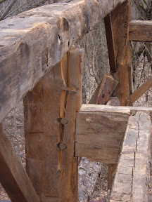 Outward thrust of the rafters on the plates split the tops of four of the posts at the tie beam.