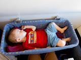 This is on our flight to Kenya for a leadership meeting. Matimu's a bit too big for the "basinets" provided for babies on flights, but he slept in it anyway. He doesn't mind tight spaces! Madagascar6 - 056.jpg