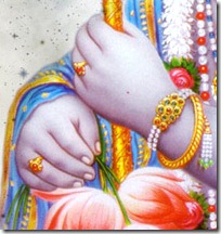 Krishna holding flute and flower